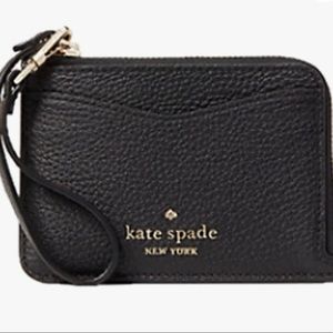 Used Kate Spade wristlet card holder, excellent condition.